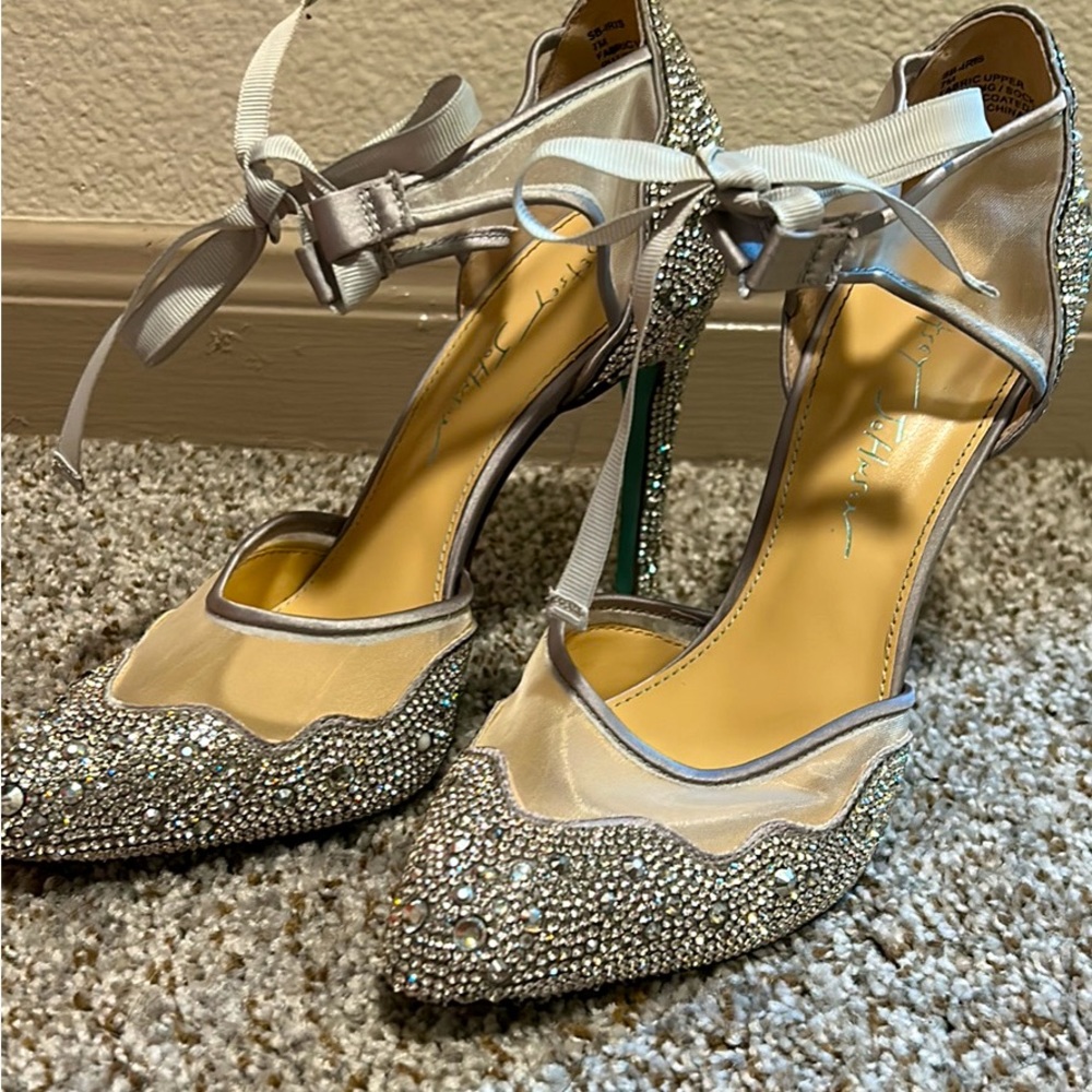Betsey Johnson high heals, in perfect condition other then the bottoms.